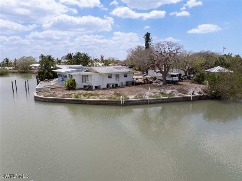 bedroom SingleFamilyResidence at 315 pettit Dr, Goodland Isles, Naples — photo 1