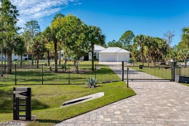 4 bedroom SingleFamilyResidence at 709 15th St SW, Golden Gate Estates, Naples — photo 1