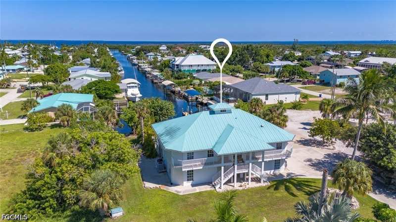 5 bedroom SingleFamilyResidence at 7380 Barrancas Ave, Knights Bokeelia Isle, Bokeelia — photo 1