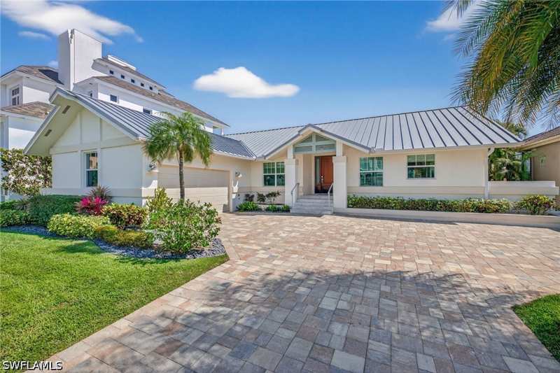 4 bedroom SingleFamilyResidence at 240 Channel Dr, Conners, Naples — photo 1