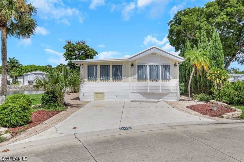 2 bedroom ManufacturedHome at 386 Leopard Ln 386, Imperial Wilderness, Naples — photo 1