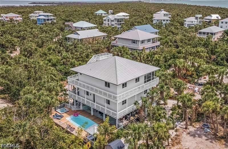 4 bedroom SingleFamilyResidence at 4490 Oyster Shell Dr, North Captiva Dunes, Upper Captiva — photo 1