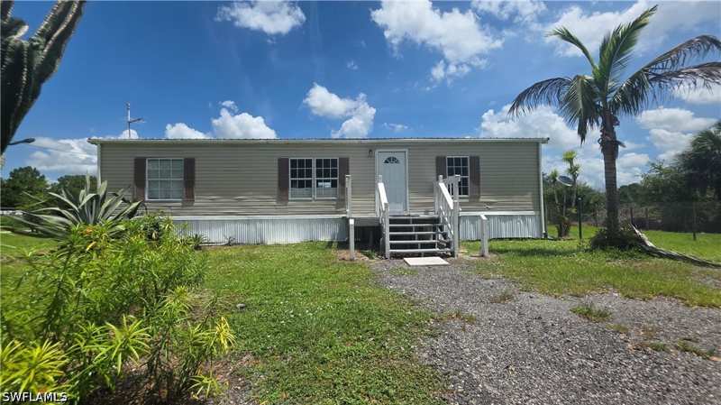 3 bedroom ManufacturedHome at 451 Bald Cypress Ave, Montura Ranch Estates, Clewiston — photo 1