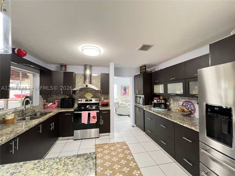4 bedroom SingleFamilyResidence at 13249 NW 9 Ln, Shoma Homes At Tamiami II, Miami — photo 1