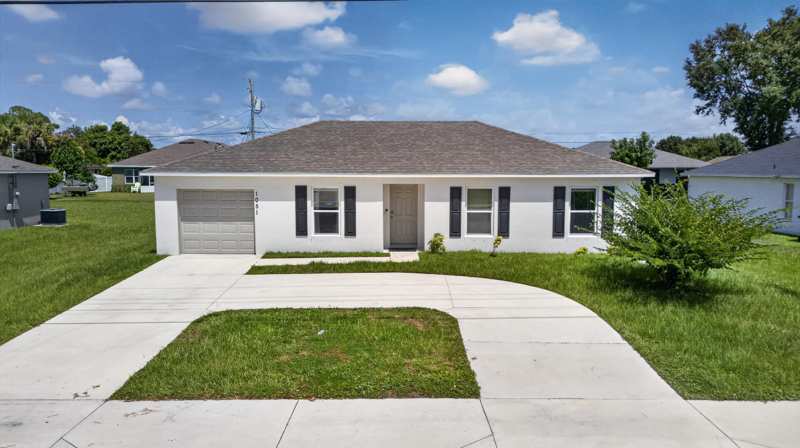 3 bedroom Single Family Residence at 1051 SW Becker Road, Port St Lucie Section 33, Port St. Lucie — photo 1