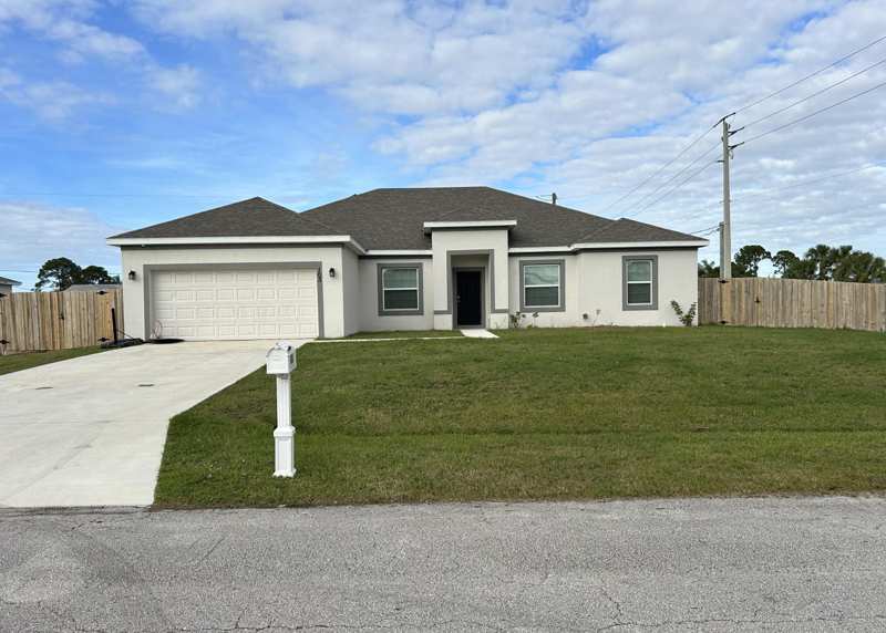 4 bedroom Single Family Residence at 103 SW Grove Avenue, Port St Lucie Section 4, Port St. Lucie — photo 1