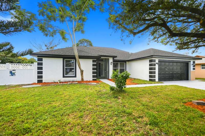 4 bedroom Single Family Residence at 942 SW John Maccormack Terrace, Port St Lucie Section 12, Port St. Lucie — photo 1
