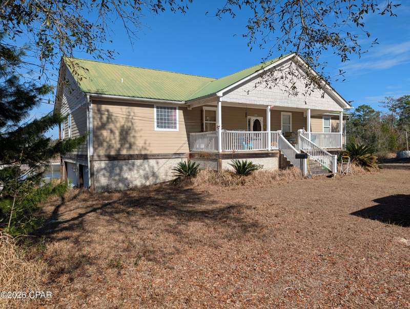 5 bedroom SingleFamilyResidence at 13920 Woodland Road, Sand Hills, Southport — photo 2