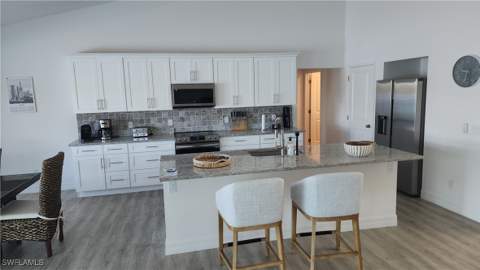 702 NW 30th Pl, Cape Coral FL - photo 7 of 30