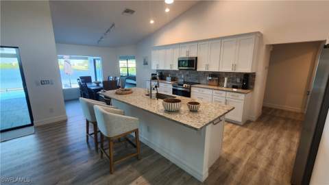702 NW 30th Pl, Cape Coral FL - photo 9 of 30