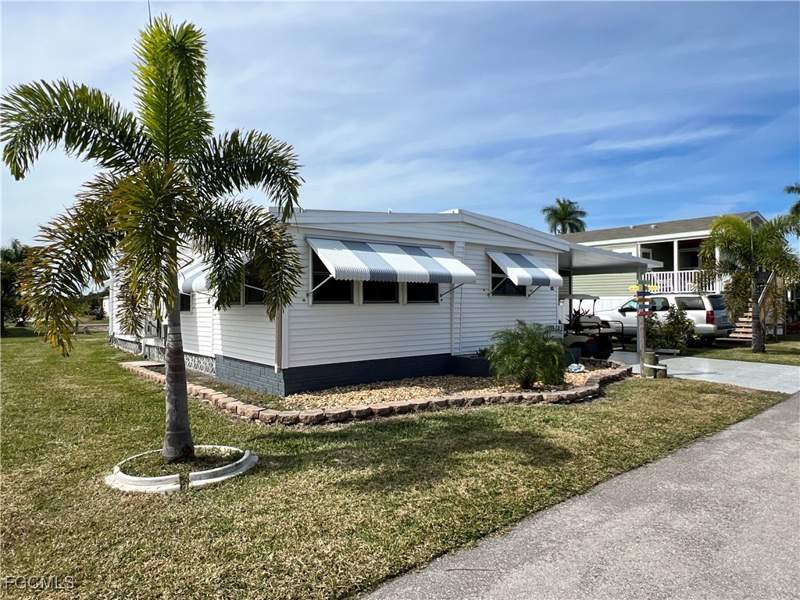 2 bedroom ManufacturedHome at 290 Valencia Dr, Orange Harbor Mobile Home Park, Fort Myers — photo 2