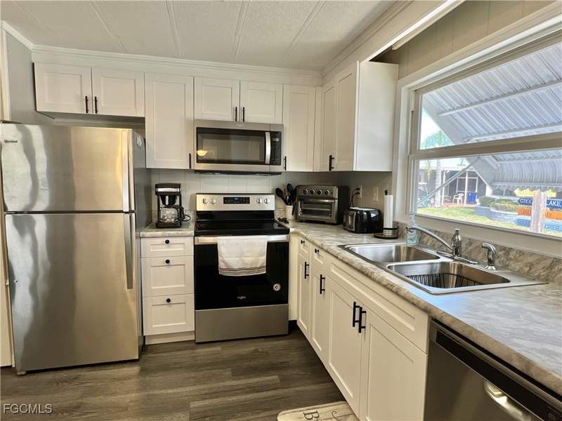 2 bedroom ManufacturedHome at 290 Valencia Dr, Orange Harbor Mobile Home Park, Fort Myers — photo 4