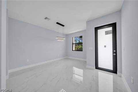 1009 Moore Ave, Lehigh Acres FL - photo 6 of 35