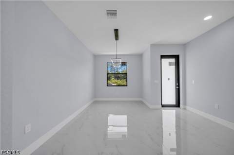 1009 Moore Ave, Lehigh Acres FL - photo 7 of 35