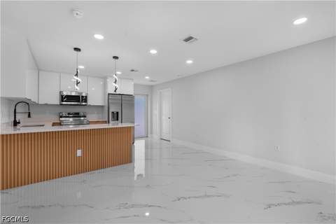940 Berg St E, Lehigh Acres FL - photo 13 of 30