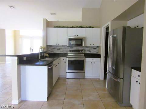 1303 SW 34th St, Cape Coral FL - photo 6 of 13