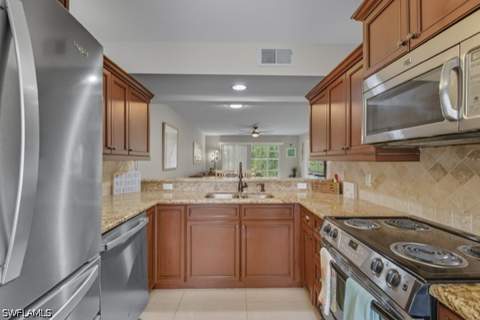 145 Robin Hood Cir 104, Naples FL - photo 7 of 34