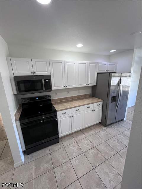 1066 Barnett St E, Lehigh Acres FL - photo 7 of 16