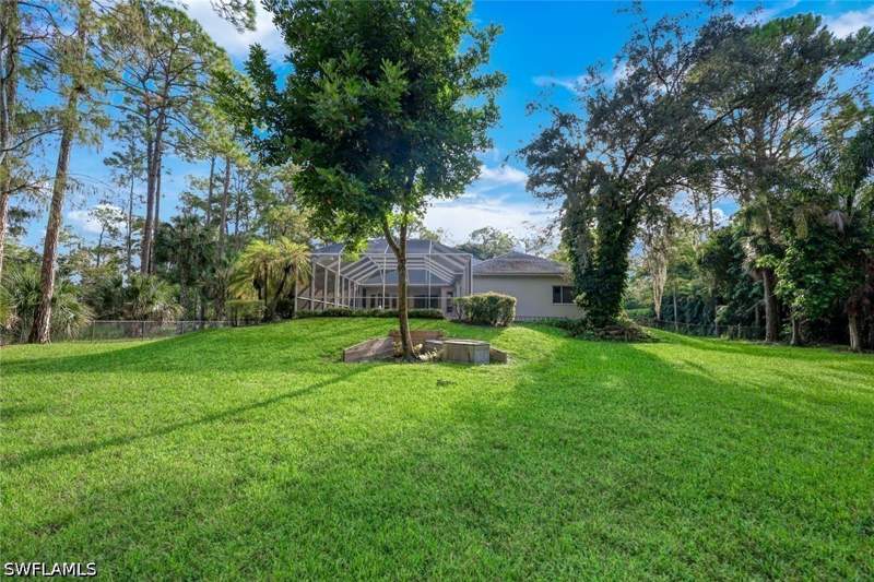 4 bedroom SingleFamilyResidence at 661 27th St NW, Golden Gate Estates, Naples — photo 2