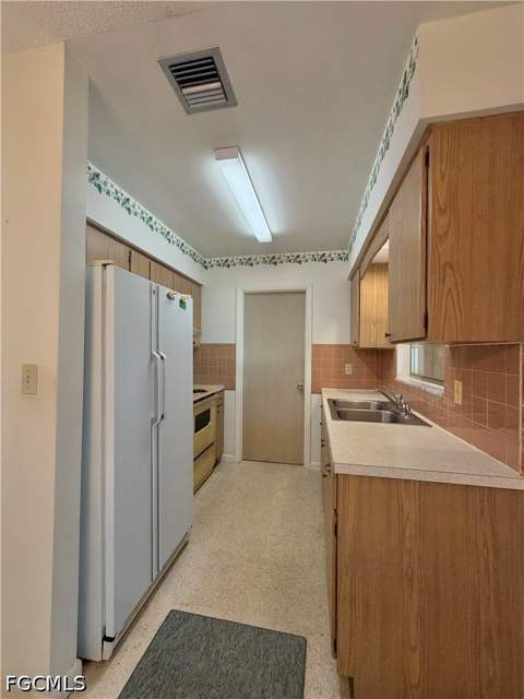 1419 Kimdale St E, Lehigh Acres FL - photo 10 of 47