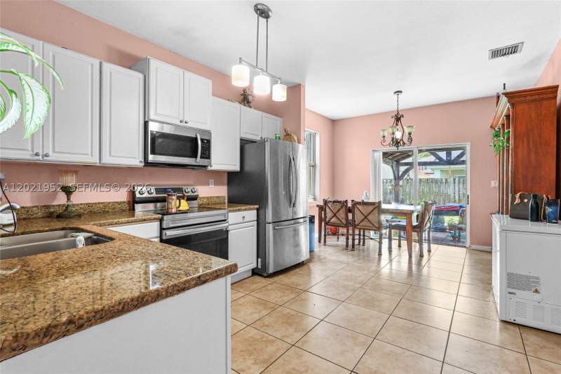 5 bedroom SingleFamilyResidence at 8956 SW 215th Ter, Precious Homes At Lakes B, Cutler Bay — photo 5
