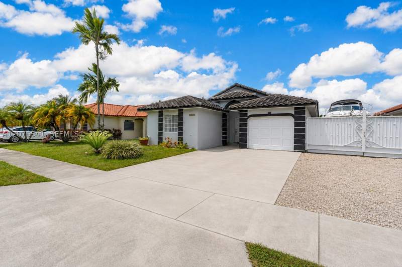 3 bedroom SingleFamilyResidence at 18230 SW 143rd Ct, Med Gardens Sec 2, Miami — photo 2