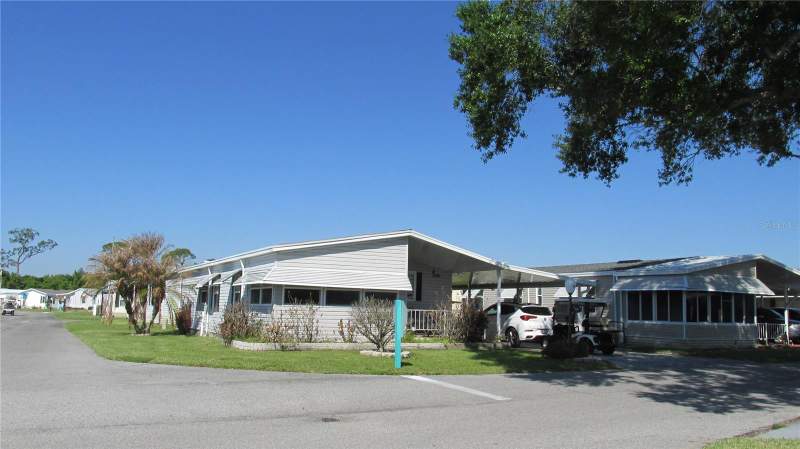 2 bedroom Manufactured Home at 102 NEWCASTLE BOULEVARD, SWEETWATER GOLF & TENNIS CLUB ADD 01, HAINES CITY — photo 1