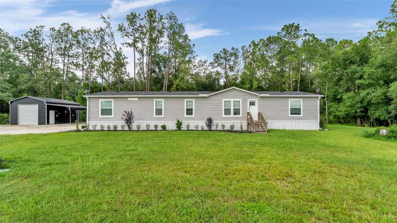 4 bedroom Manufactured Home at 12615 OLD DADE CITY ROAD, FARMLAND ACRES, KATHLEEN — photo 1