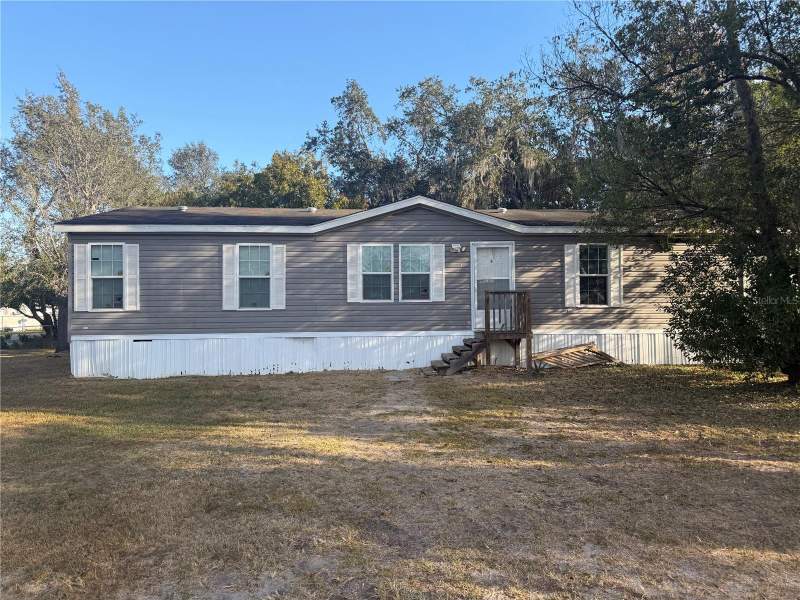4 bedroom Manufactured Home at 6412 OLD LAKE WILSON ROAD, TOWN/LOUGHMAN, DAVENPORT — photo 1