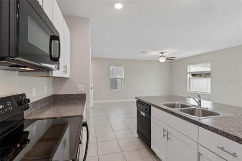 3715 Daisy Bloom Place, Tampa FL - photo 12 of 81