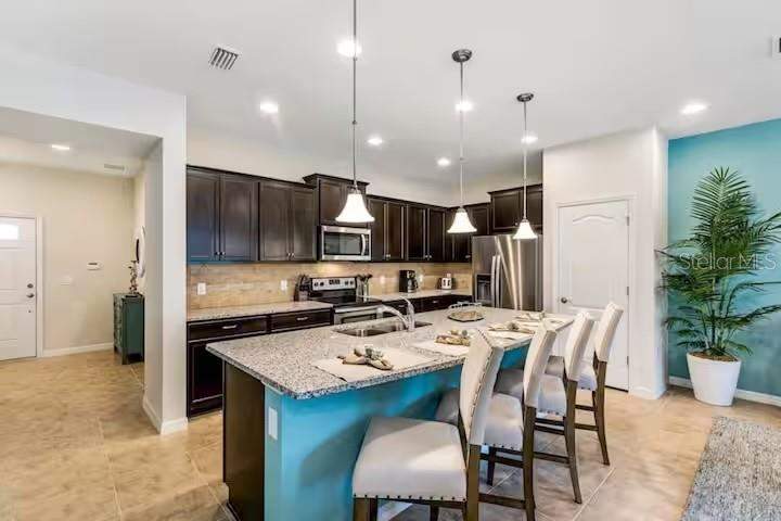 5 bedroom Townhouse at 8887 Geneve Court, Windsor At Westside Ph 2B, Kissimmee — photo 5