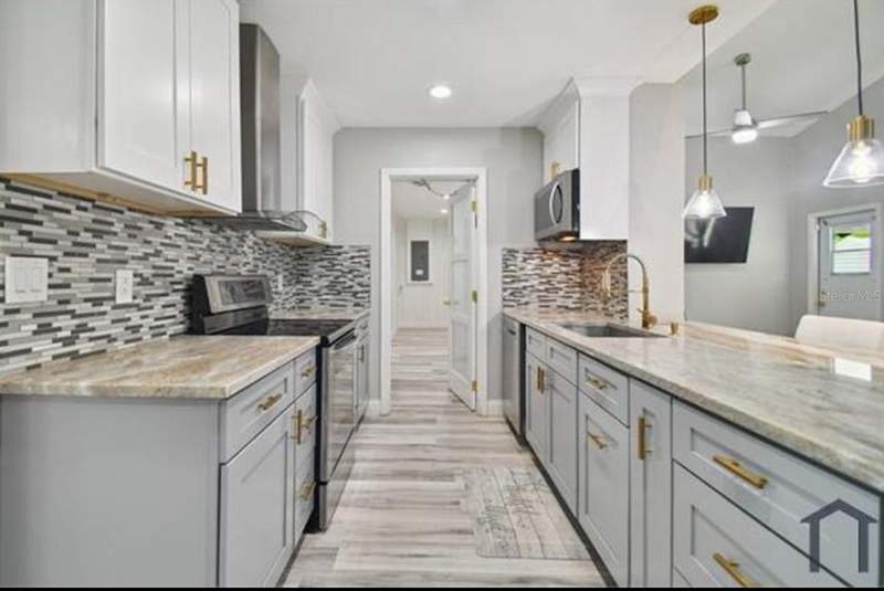 4 bedroom Single Family Residence at 6745 Ralston Beach Circle, Ralston Beach Manor Unit 3, Tampa — photo 4