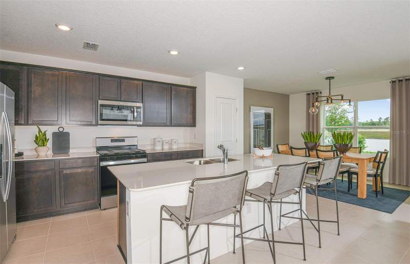 5 bedroom Single Family Residence at 9911 Trellis Vine Way, Oakfield Trails Phase I, Parrish — photo 4