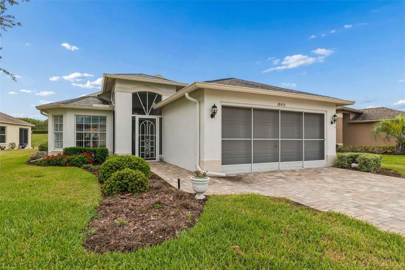 3 bedroom Single Family Residence at 18452 Fairway Green Drive, Heritage Pines Village 13, Hudson — photo 2