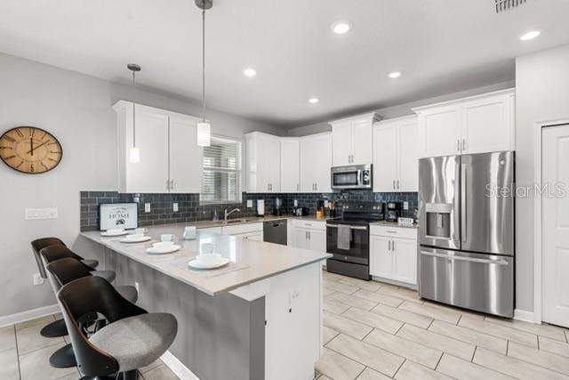 6 bedroom Single Family Residence at 8909 Stinger Drive, Stoneybrook South Ph J-2 & J-3, Champions Gate — photo 5