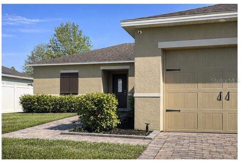 3 bedroom Single Family Residence at 418 BLUE LAKE CIRCLE, FIELDSTONE AT CYPRESS WOODS WEST, KISSIMMEE — photo 2