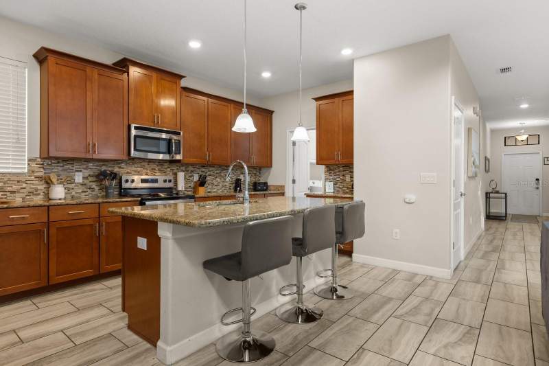 5 bedroom Single Family Residence at 5493 Solterra Circle, Solterra Ph 1, Davenport — photo 4