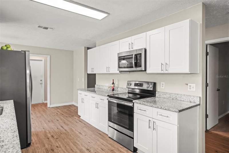 3 bedroom Single Family Residence at 13200 Titleist Drive, Wood View At Meadow Oaks, Hudson — photo 4