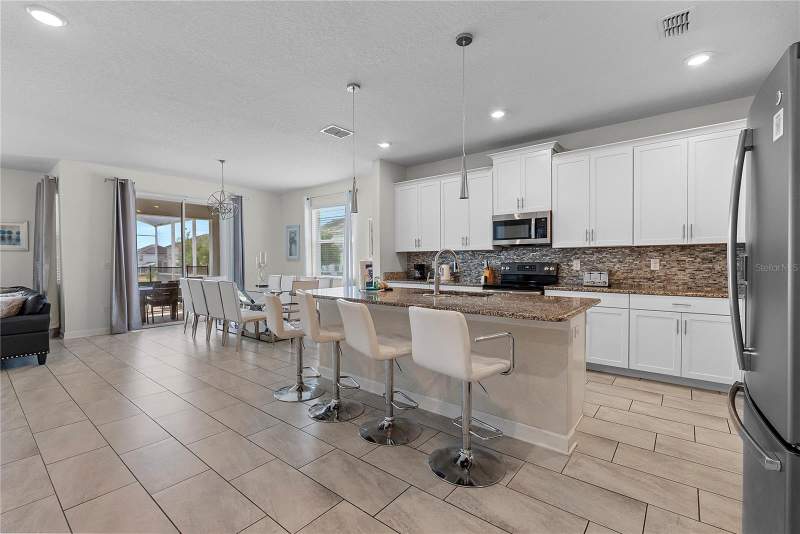 6 bedroom Single Family Residence at 1559 Flange Drive, Stoneybrook South Ph I-1 & J-1, Davenport — photo 2