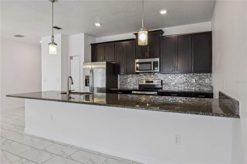4 bedroom Townhouse at 1584 Slice Way, Stoneybrook South Ph I-1 & J-1, Davenport — photo 4