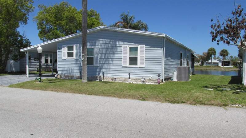 2 bedroom Manufactured Home at 91 STRAPHMORE DRIVE, SWEETWATER GOLF & TENNIS CLUB, HAINES CITY — photo 1
