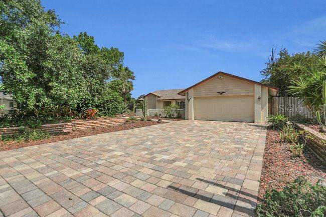 4 bedroom Single Family Residence at 9319 WOODBREEZE BOULEVARD, SILVER WOODS, WINDERMERE — photo 2