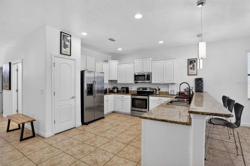 8 bedroom Single Family Residence at 9107 El Caro Lane, Stoneybrook South Ph 1, Davenport — photo 2