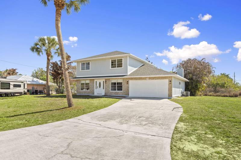 5 bedroom Single Family Residence at 405 NE Midvale Street, Port St Lucie Section 26, Port St. Lucie — photo 2