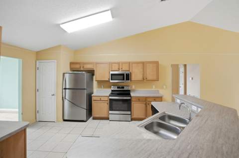 1692 SW Lofgren Avenue, Port St. Lucie FL - photo 10 of 59