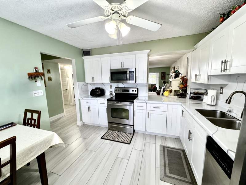 2 bedroom Condominium at 4930 E Sabal Palm Boulevard #107, Lakes Of Carriage Hills, Tamarac — photo 3
