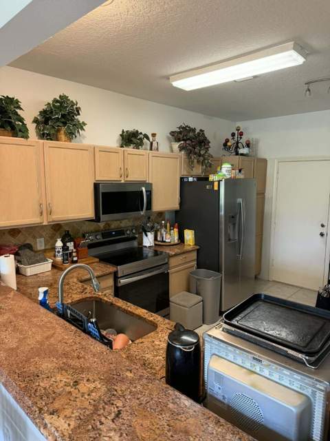 1102 Woodfield Road, Greenacres FL - photo 8 of 16