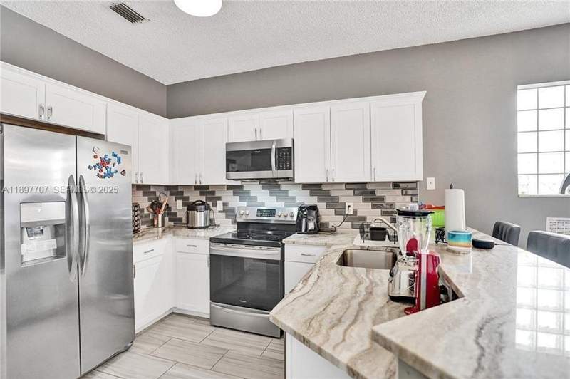 3 bedroom Single Family Residence at 4824 NW 19th Street, Lyons West, Coconut Creek — photo 3