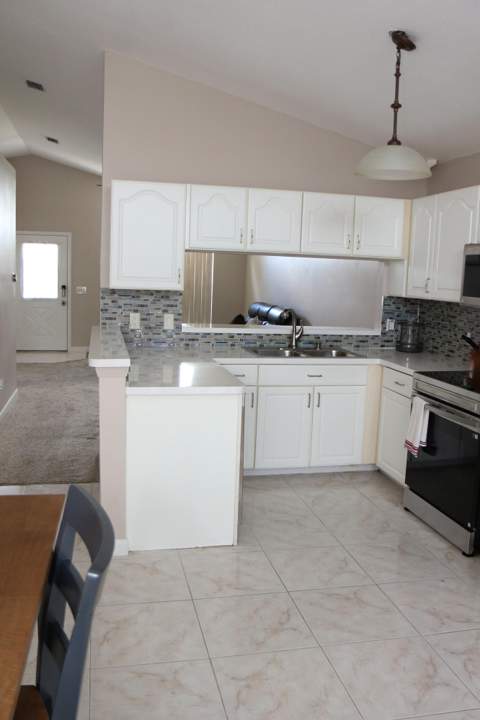 1160 NW Lombardy Drive, Port St. Lucie FL - photo 7 of 42