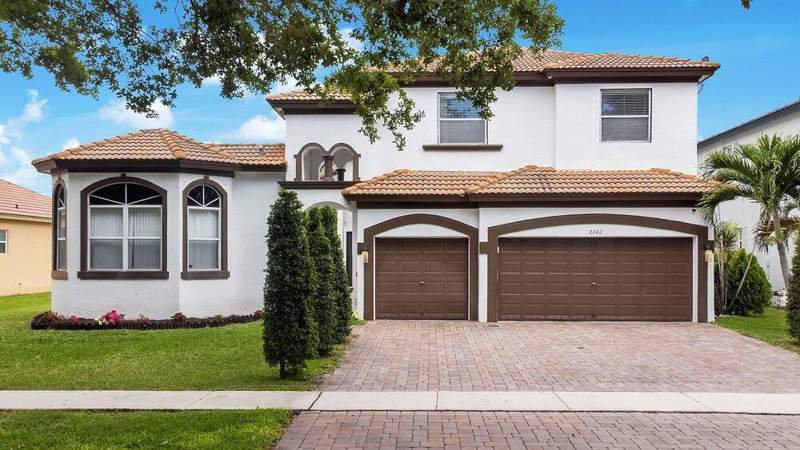 6 bedroom Single Family Residence at 2242 SW 130th Terrace, Pod 2 At Monarch Lakes, Miramar — photo 2